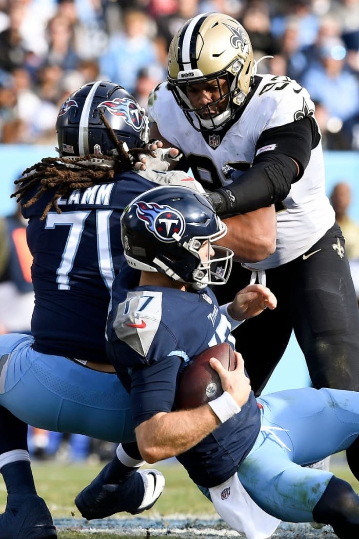 Tennessee quarterback Ryan Tannehill (17) gets sacked by New Orleans Saints defensive end Marcus Davenport (92). © George Walker IV / Tennessean.com / USA TODAY NETWORK